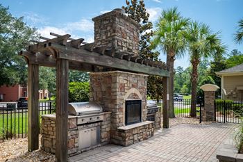 Exquisite outdoor fireplace w/ gas grills